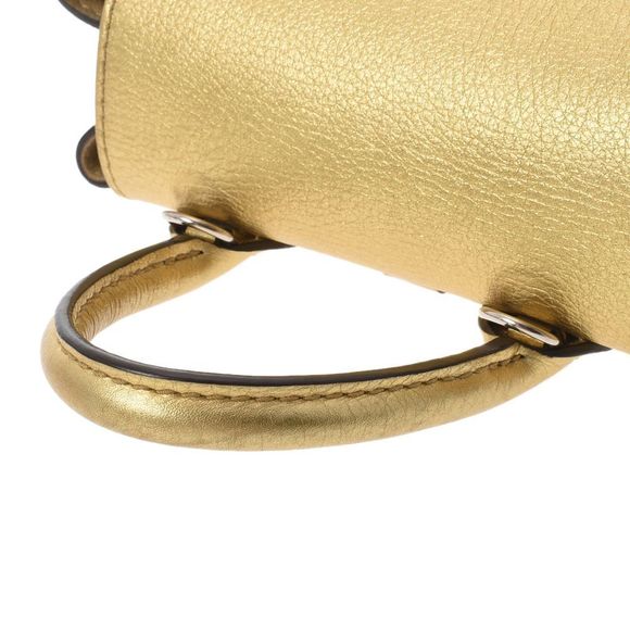 Louis Vuitton Lock Me Backpack Mini Gold Silver Leather Daypack - Picture 3 of 7